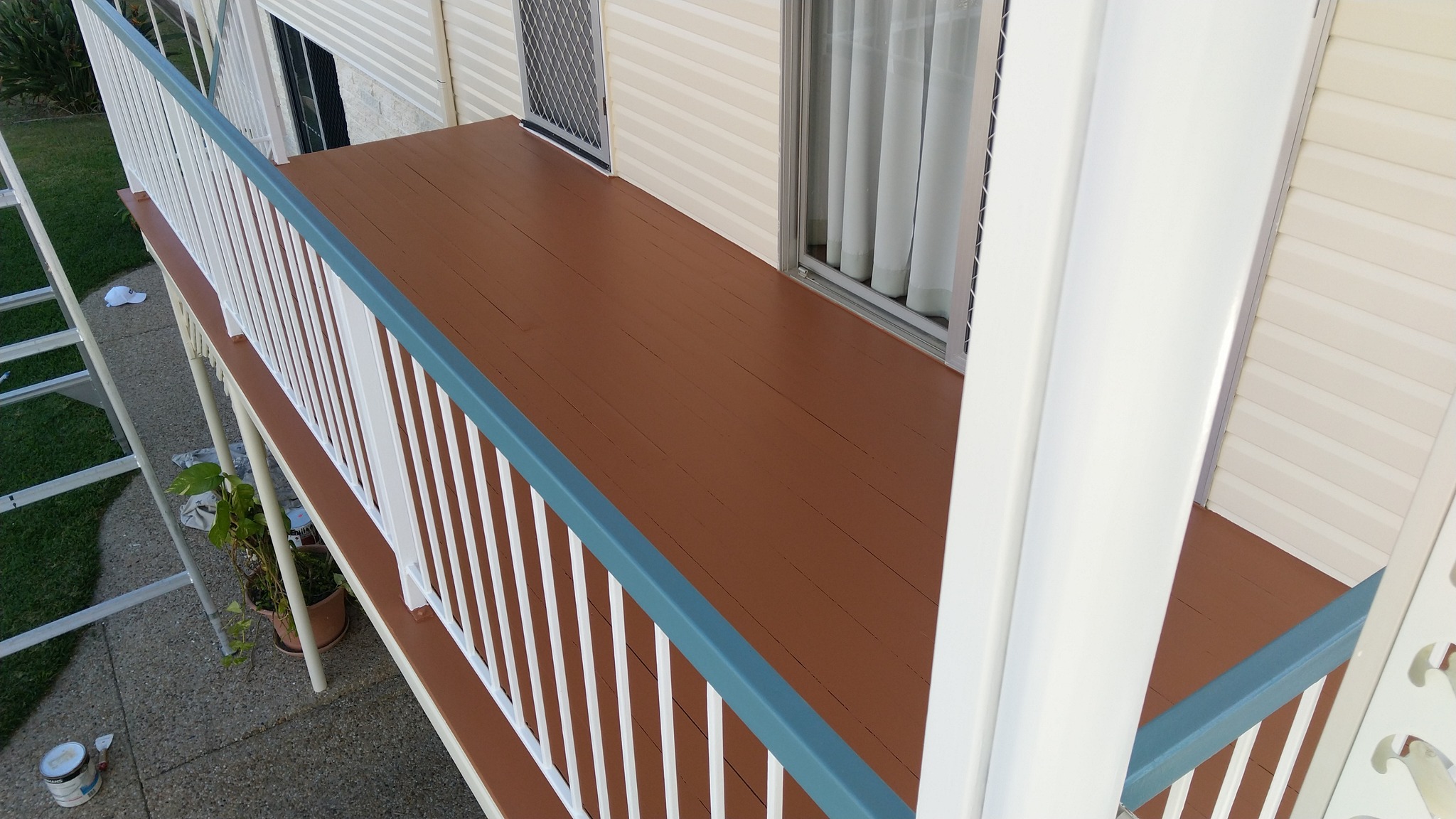 Cream House with Blue Trim